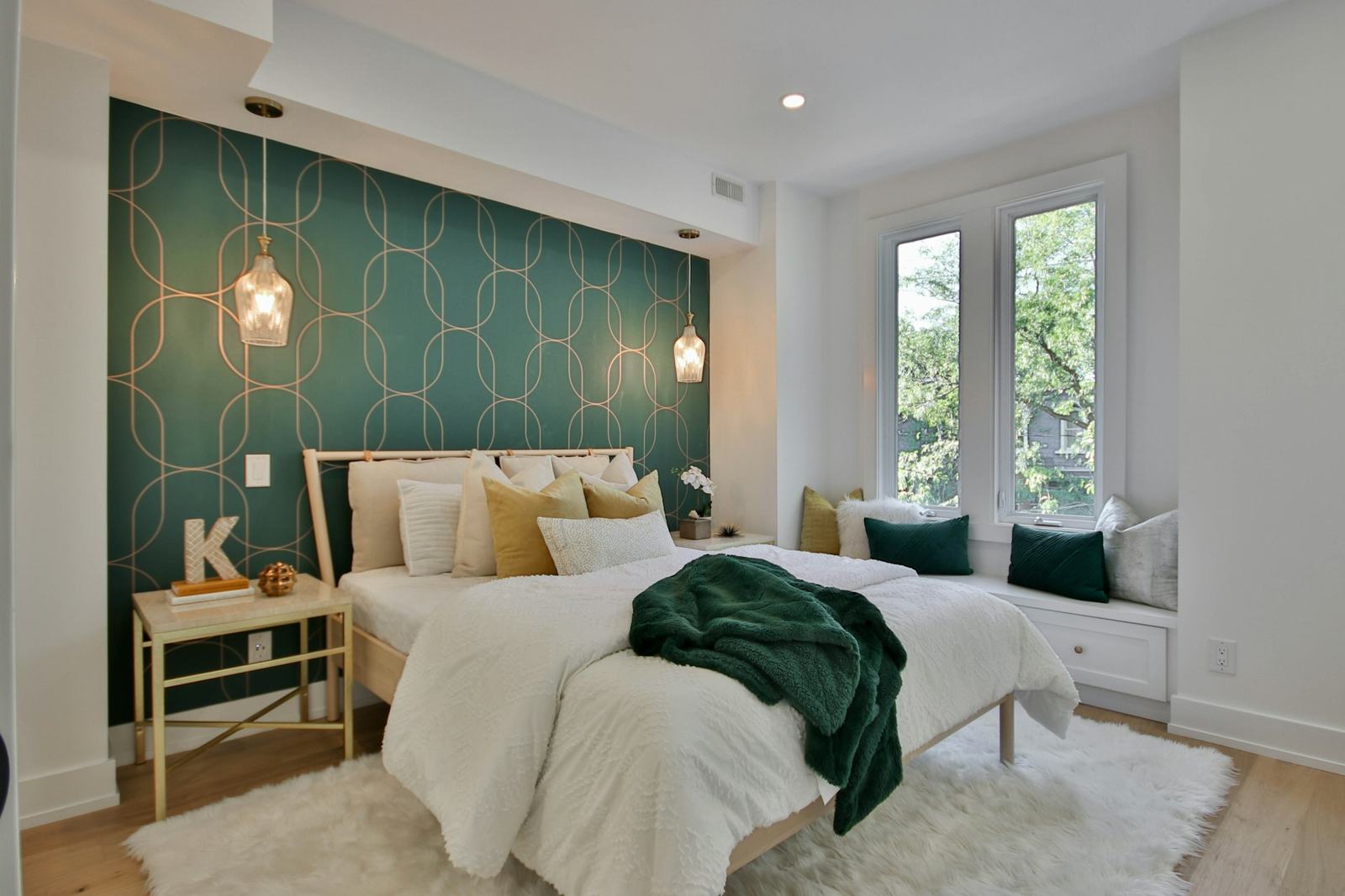 Bedroom with a green feature wall